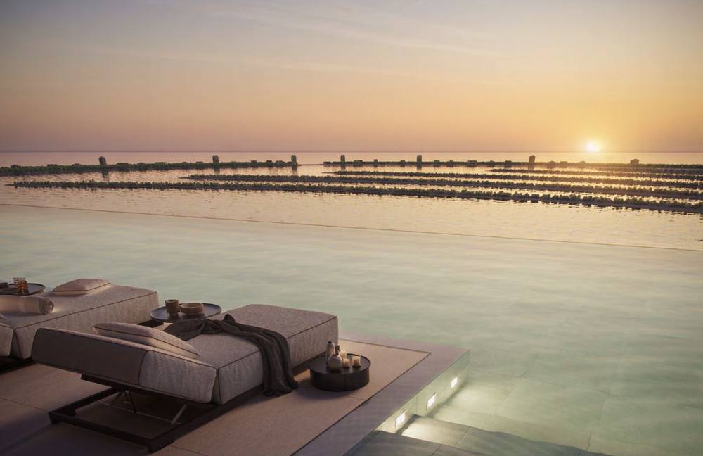 Beachfront Immobilienlage in Dubai bei Sonnenuntergang